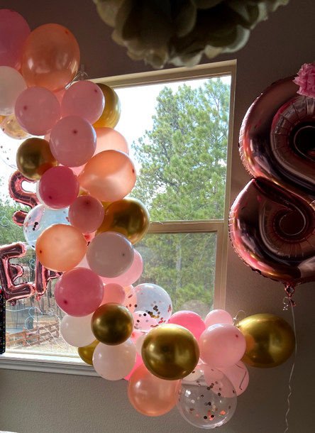 Blush, coral and gold balloon display photographed at a Blown Away celebration